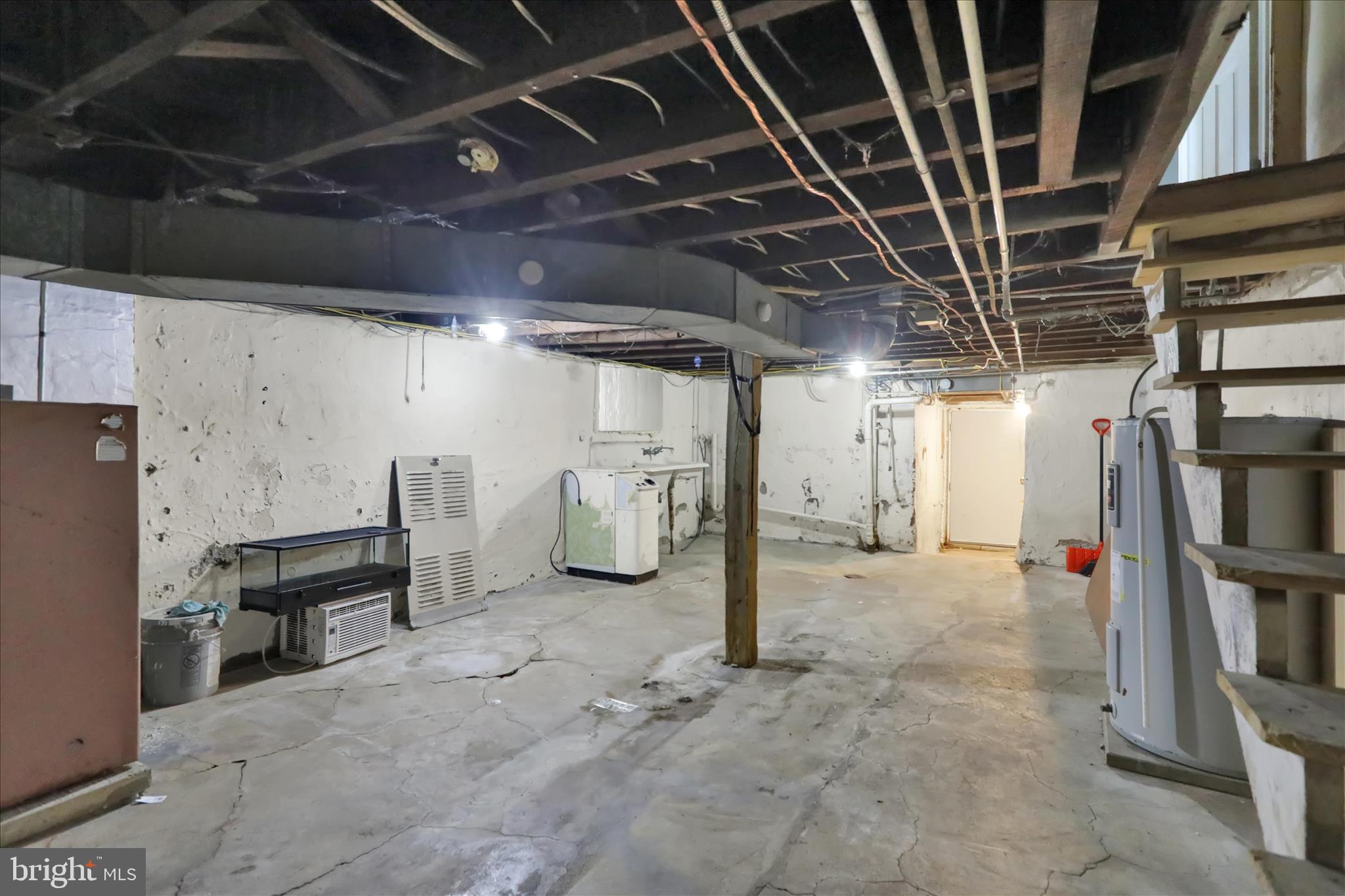 645 Lancaster Avenue Reading, PA 19611 - Photo 34 of 36 a view of water heater room with refrigerator and washer