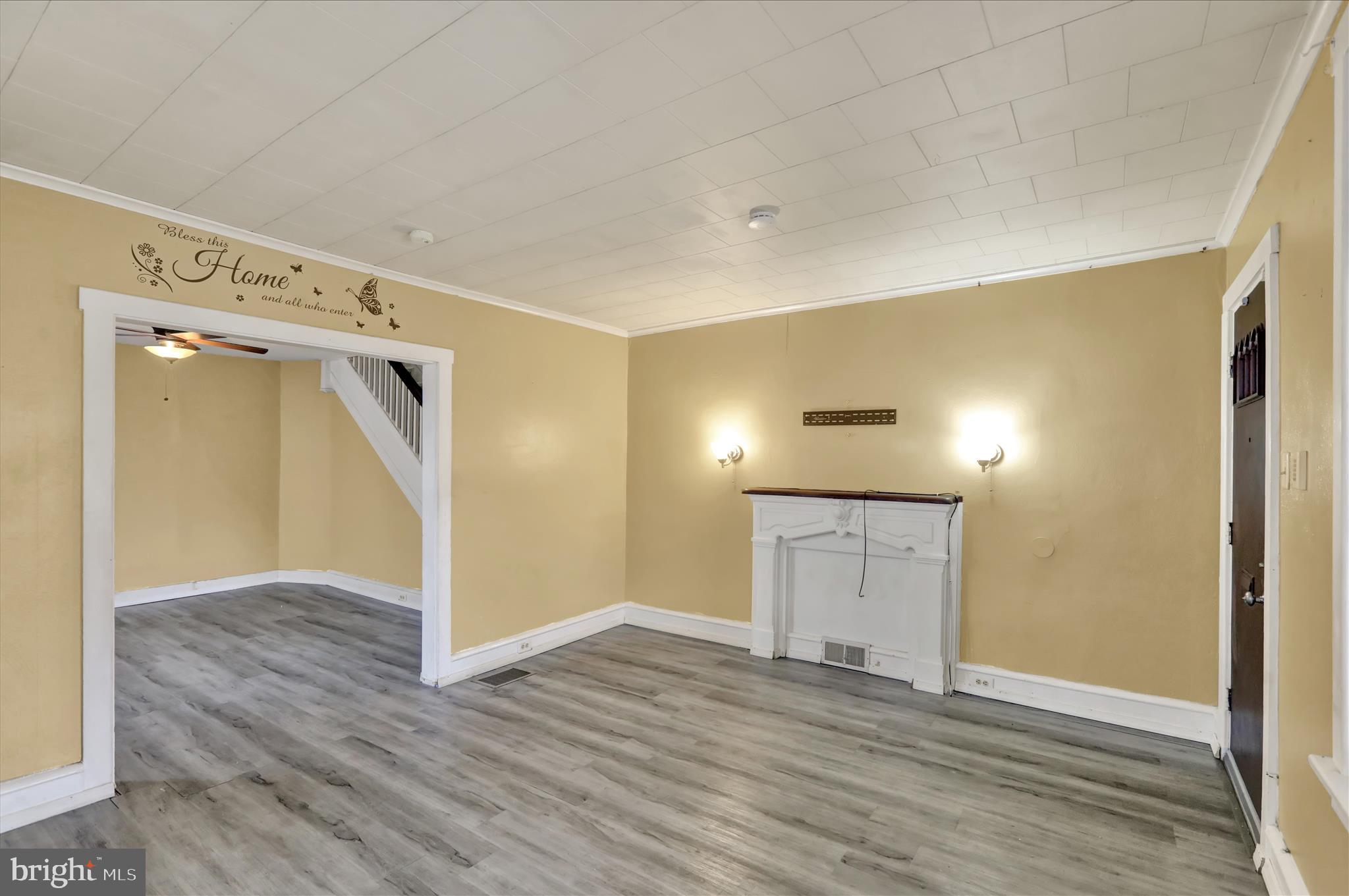 645 Lancaster Avenue Reading, PA 19611 - Photo 8 of 36 a view of an empty room with wooden floor and a window