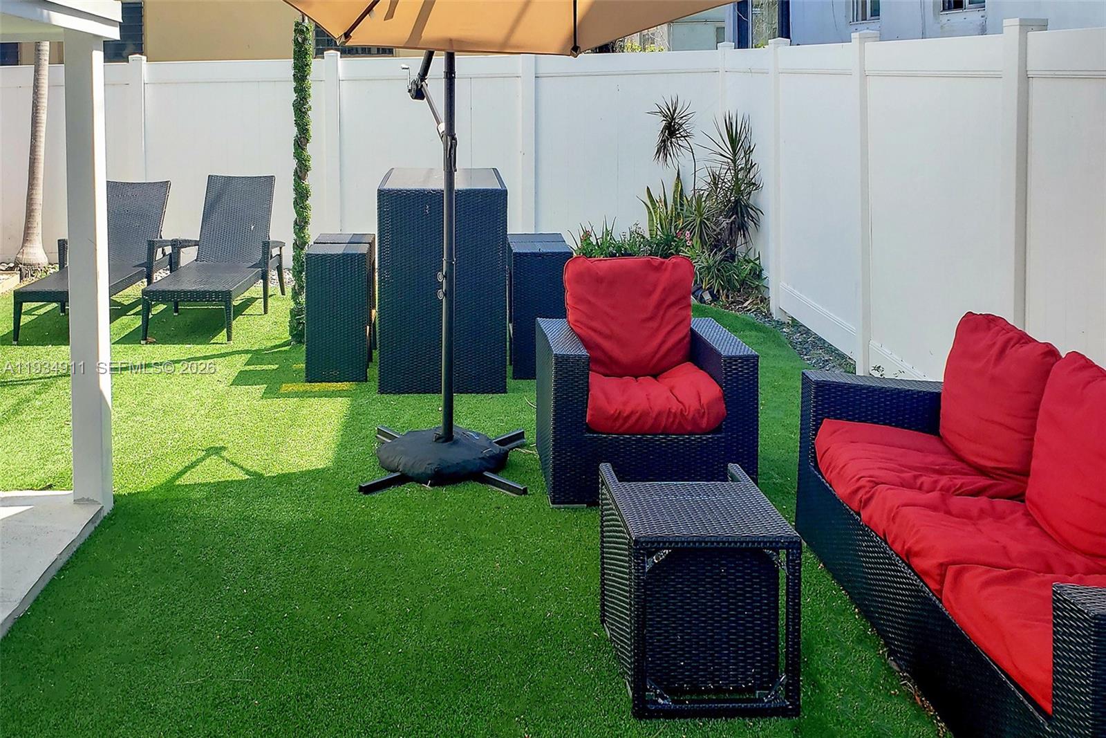 8430 Harding Avenue, Unit 4A Miami Beach, FL 33141 - Photo 17 of 43 a view of a backyard with sitting area