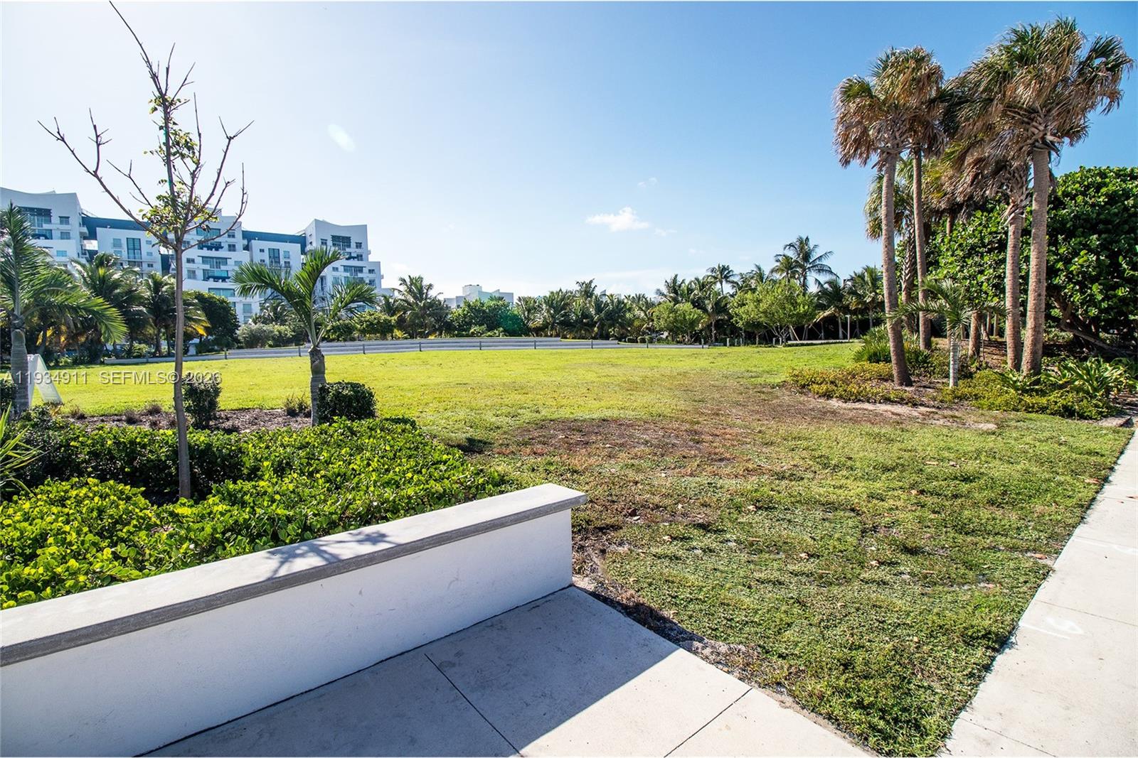 8430 Harding Avenue, Unit 4A Miami Beach, FL 33141 - Photo 21 of 43 a view of a yard with an outdoor seating