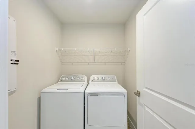 a view of a bathroom with sink mirror and bathtub