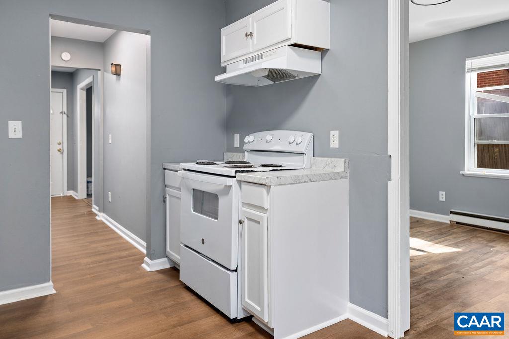 904 Rockcreek Road Charlottesville, VA 22903 - Photo 11 of 25 a view of a kitchen with cabinets and wooden floor