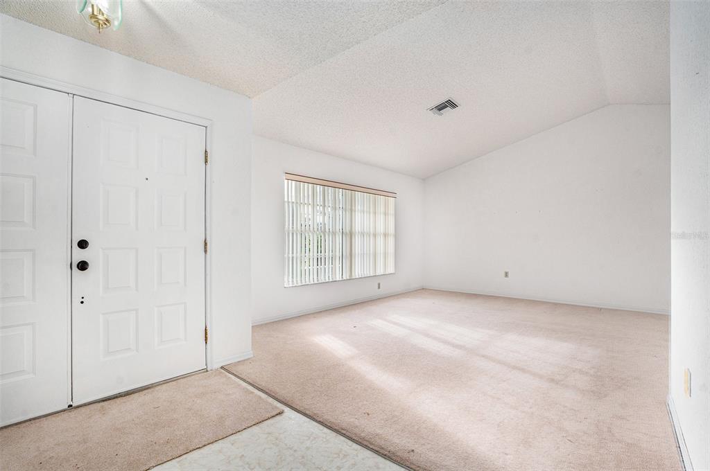 1247 Venetia Drive Spring Hill, FL 34608 - Photo 21 of 27 a view of an empty room with a window