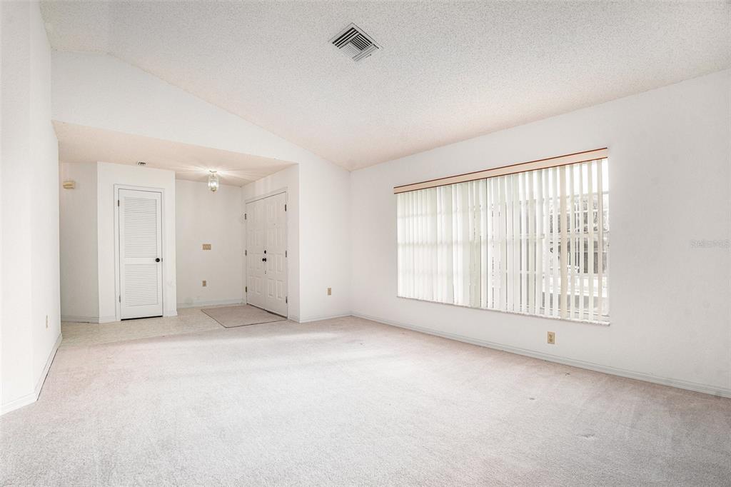 1247 Venetia Drive Spring Hill, FL 34608 - Photo 22 of 27 a view of an empty room with a window