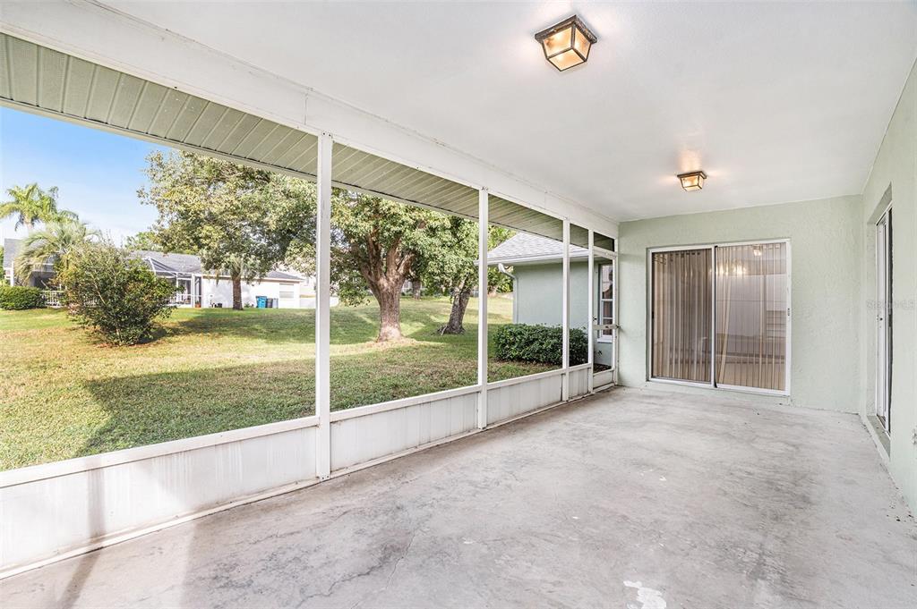 1247 Venetia Drive Spring Hill, FL 34608 - Photo 24 of 27 a view of an empty room with yard and balcony