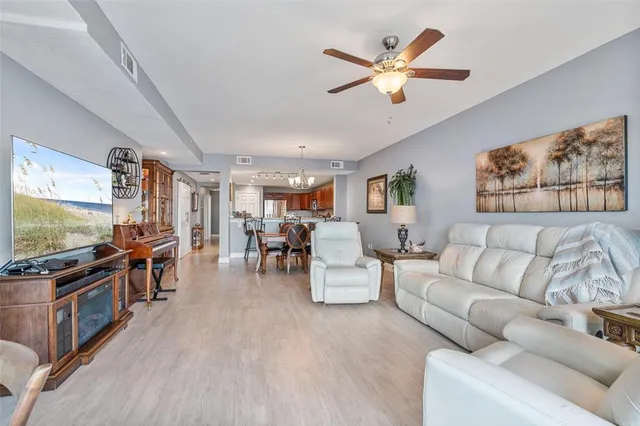 a view of a dining room with furniture wooden floor and chandelier