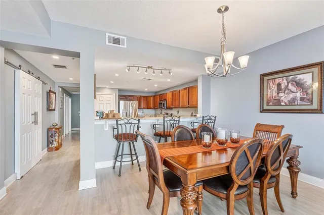 a living room with furniture fireplace and a large window