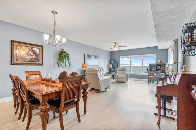 a kitchen with stainless steel appliances granite countertop wooden cabinets a stove top oven a sink and dishwasher