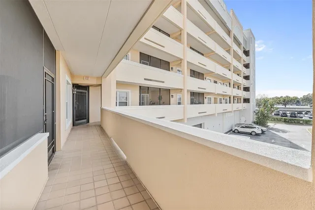 a large kitchen with stainless steel appliances granite countertop a sink and dishwasher a stove with cabinets next to a window