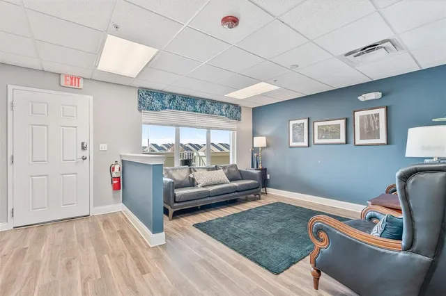 a view of a hallway with seating area