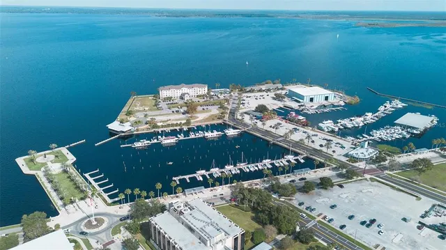 an aerial view of a house with yard swimming pool and outdoor seating