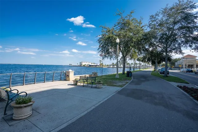 a balcony with table and chairs