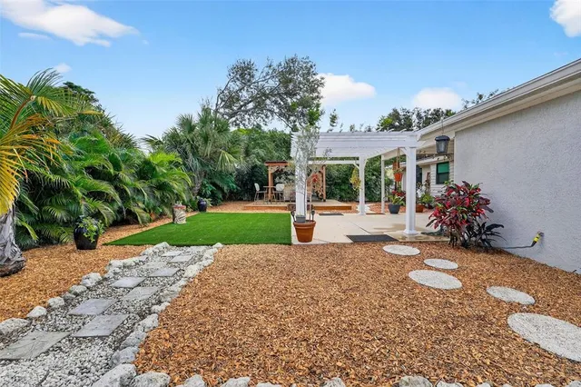 a view of a garden with a patio