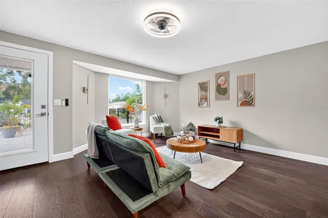 a living room with furniture and a window