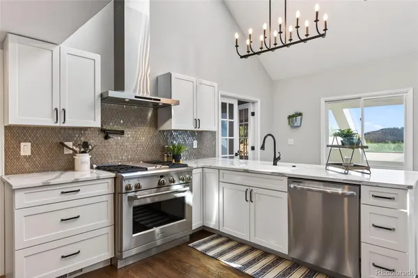 a kitchen with a sink stove and cabinets