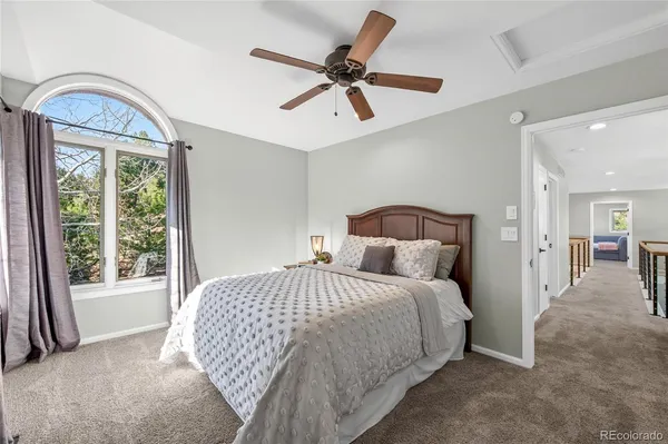 a living room with furniture and a stairs
