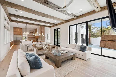 a kitchen with granite countertop a stove a sink and a refrigerator