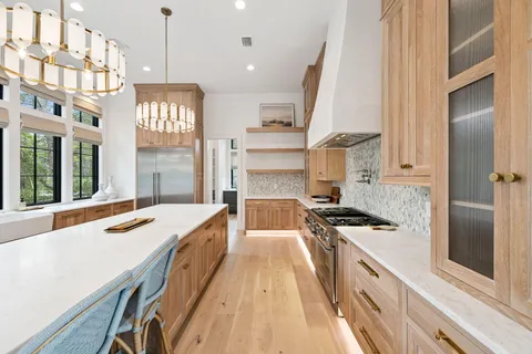 a room with a sink and a large window