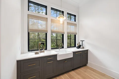 a bedroom with bed and large window