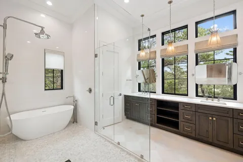 a bedroom with a large bed and a large window