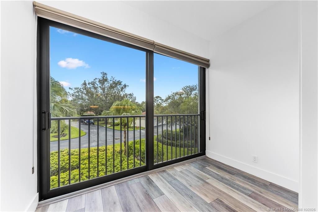 13468 Northwest Harbour Ridge Boulevard, Unit 2A Palm City, FL 34990 - Photo 16 of 38 a view of a balcony