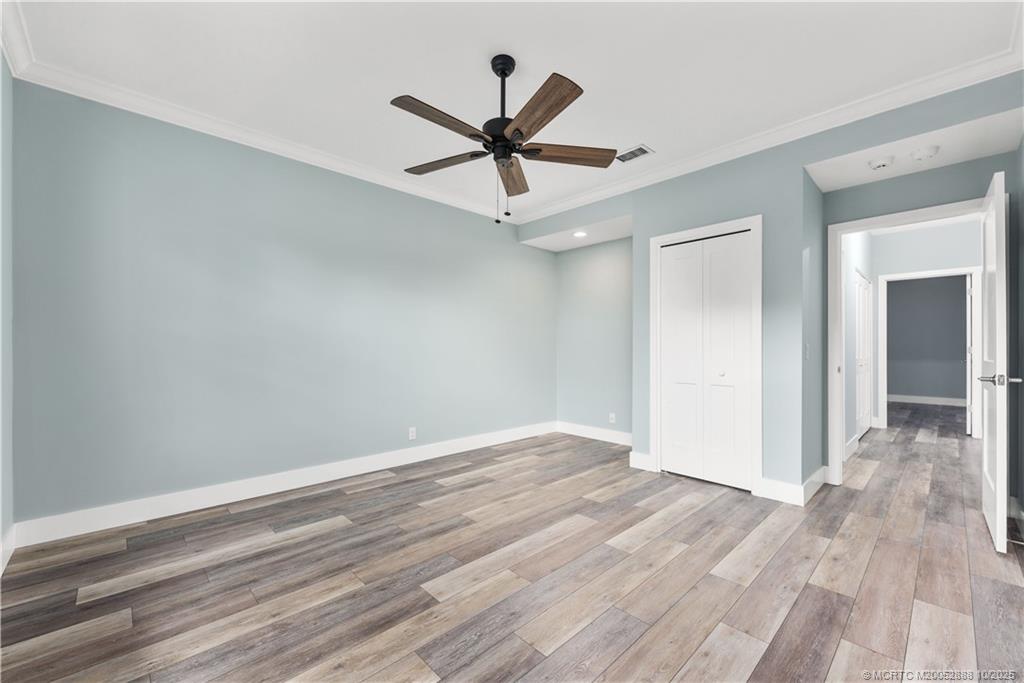 13468 Northwest Harbour Ridge Boulevard, Unit 2A Palm City, FL 34990 - Photo 24 of 38 a view of a hallway with wooden floor