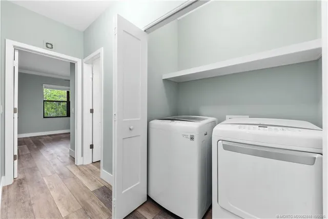 a view of storage and utility room with washer and dryer