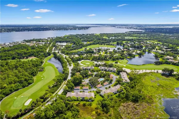 a view of a lake with a yard