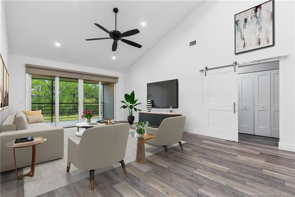 a living room with furniture and a window