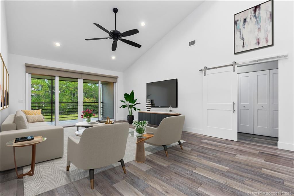 13468 Northwest Harbour Ridge Boulevard, Unit 2A Palm City, FL 34990 - Photo 5 of 38 a living room with furniture and a window