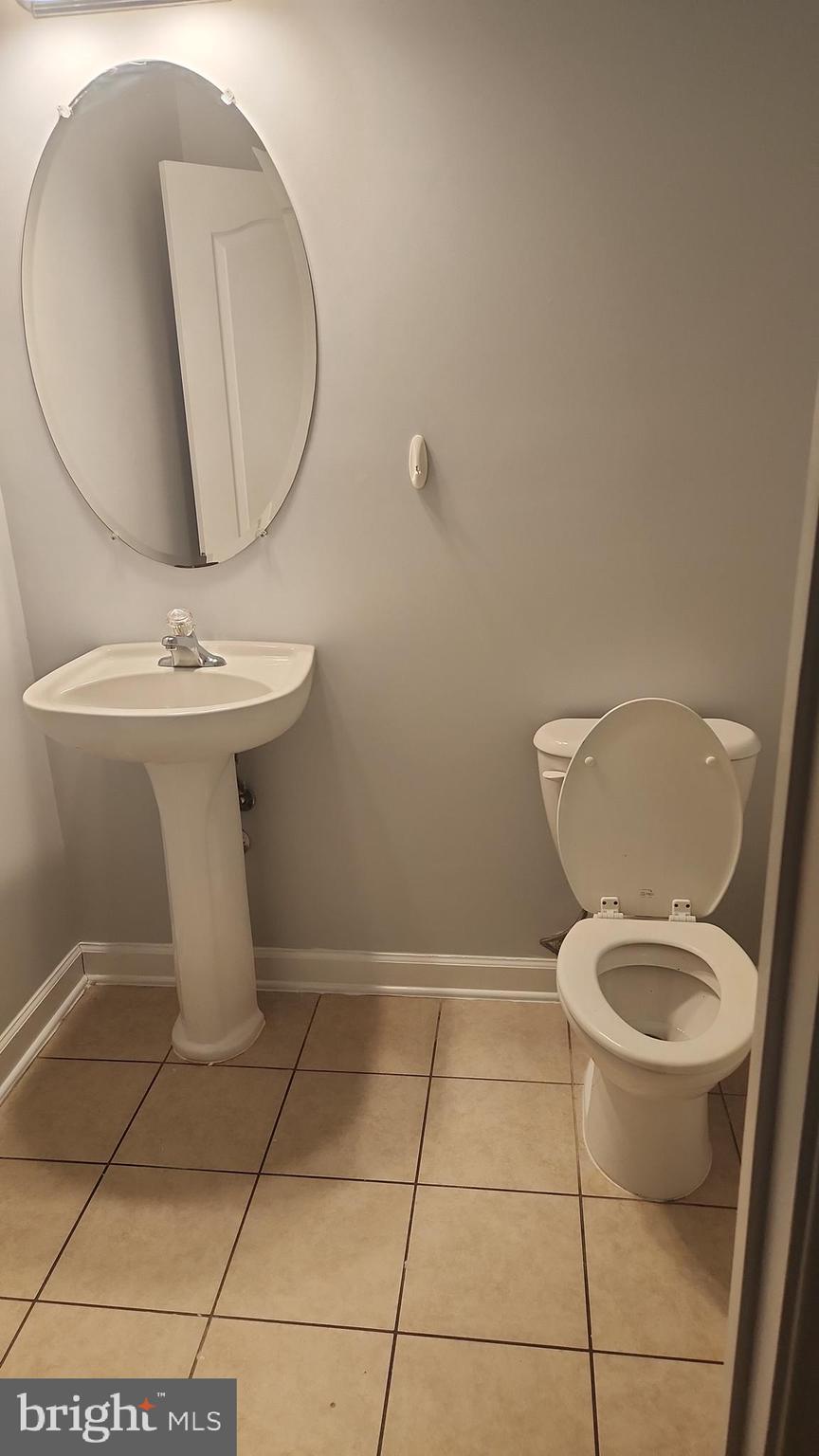 11612 Leesborough Circle Silver Spring, MD 20902 - Photo 13 of 29 a bathroom with a toilet and a mirror