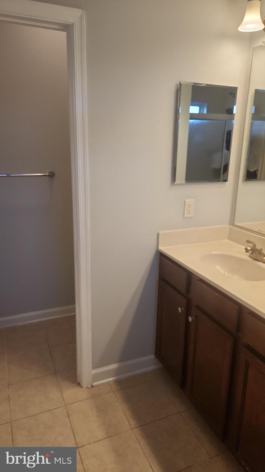 11612 Leesborough Circle Silver Spring, MD 20902 - Photo 21 of 29 a bathroom with a sink and a mirror
