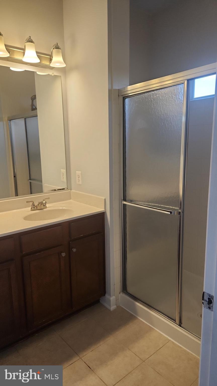 11612 Leesborough Circle Silver Spring, MD 20902 - Photo 22 of 29 a bathroom with a double vanity sink and mirror