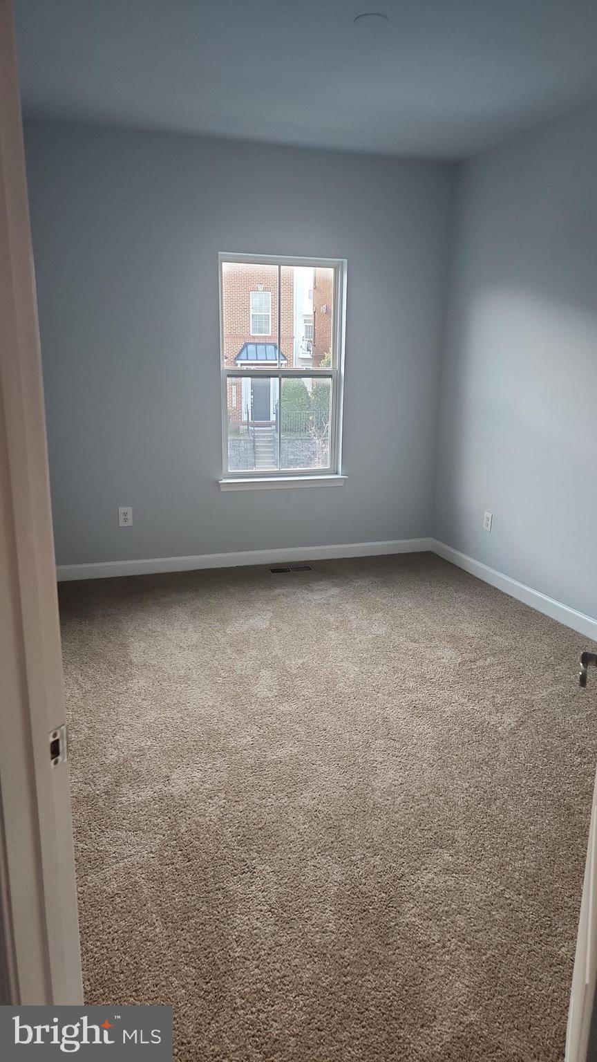 11612 Leesborough Circle Silver Spring, MD 20902 - Photo 27 of 29 an empty room with a window