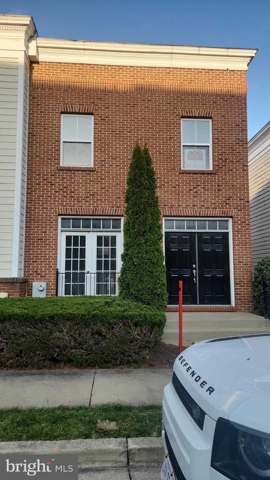 11612 Leesborough Circle Silver Spring, MD 20902 - Photo 4 of 29 a front view of a house with a garden
