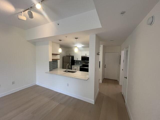 1155 Main Street, Unit 209 Jupiter, FL 33458 - Photo 3 of 10 a view of a kitchen and a sink