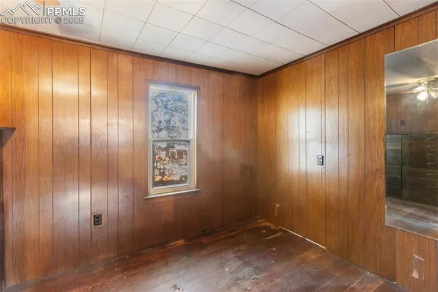 a view of an empty room with wooden door