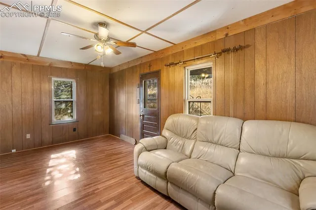 a living room with furniture and a window