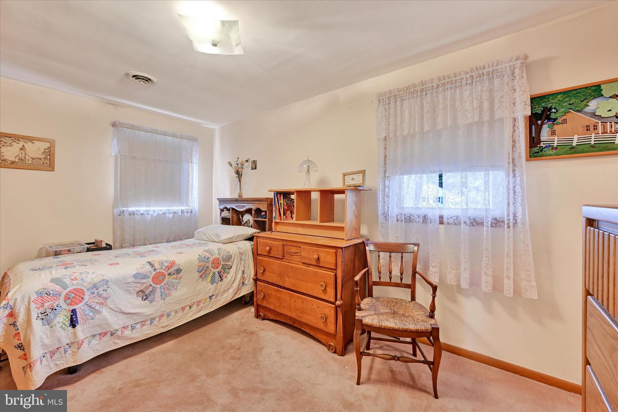 700 Remington Road Fallston, MD 21047 - Photo 19 of 42 a bedroom with a bed and a chair in it