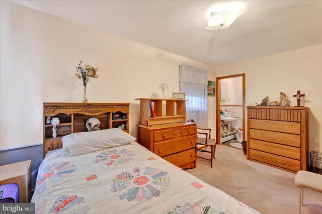 a bedroom with a bed and cabinets