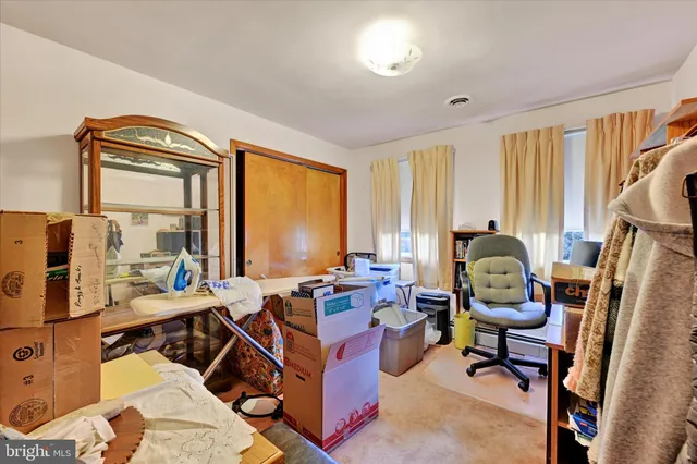 a room with gym equipment and a large window