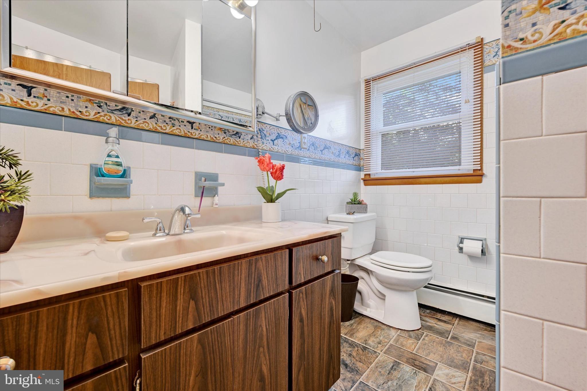 700 Remington Road Fallston, MD 21047 - Photo 24 of 42 a bathroom with a sink a toilet and a mirror