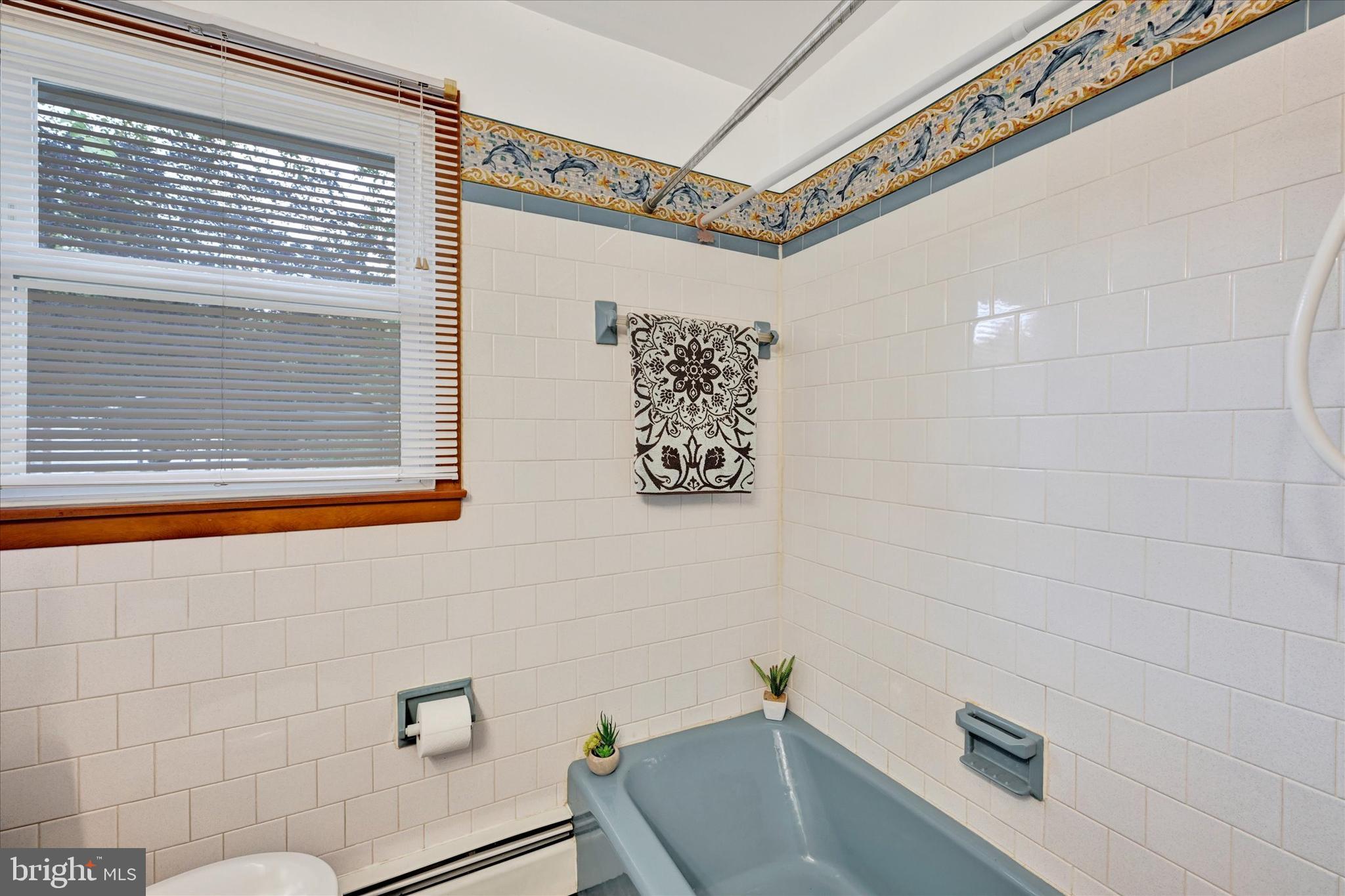 700 Remington Road Fallston, MD 21047 - Photo 25 of 42 a bathroom with a tub and a window