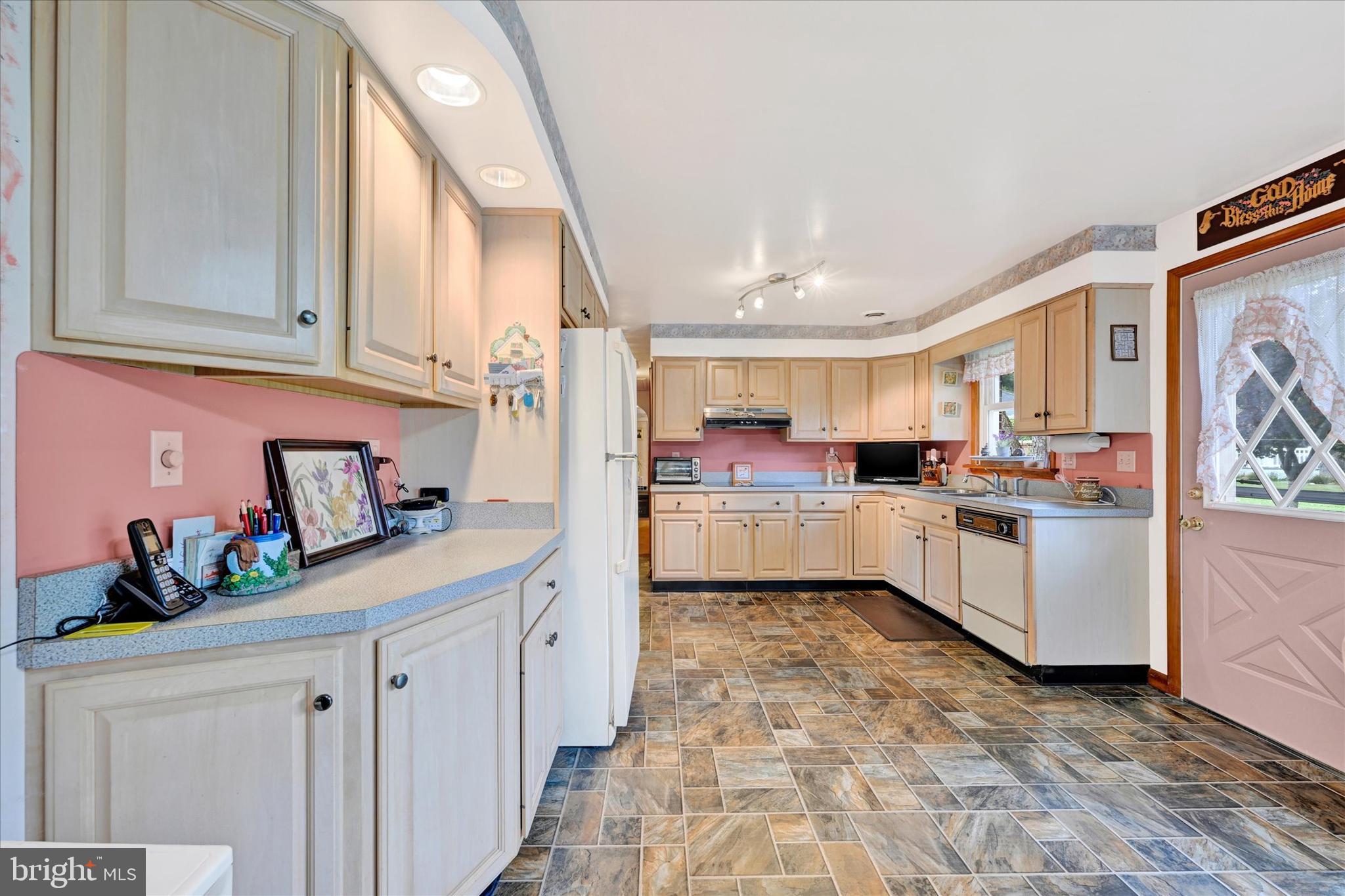 700 Remington Road Fallston, MD 21047 - Photo 4 of 42 a kitchen with white cabinets and white appliances