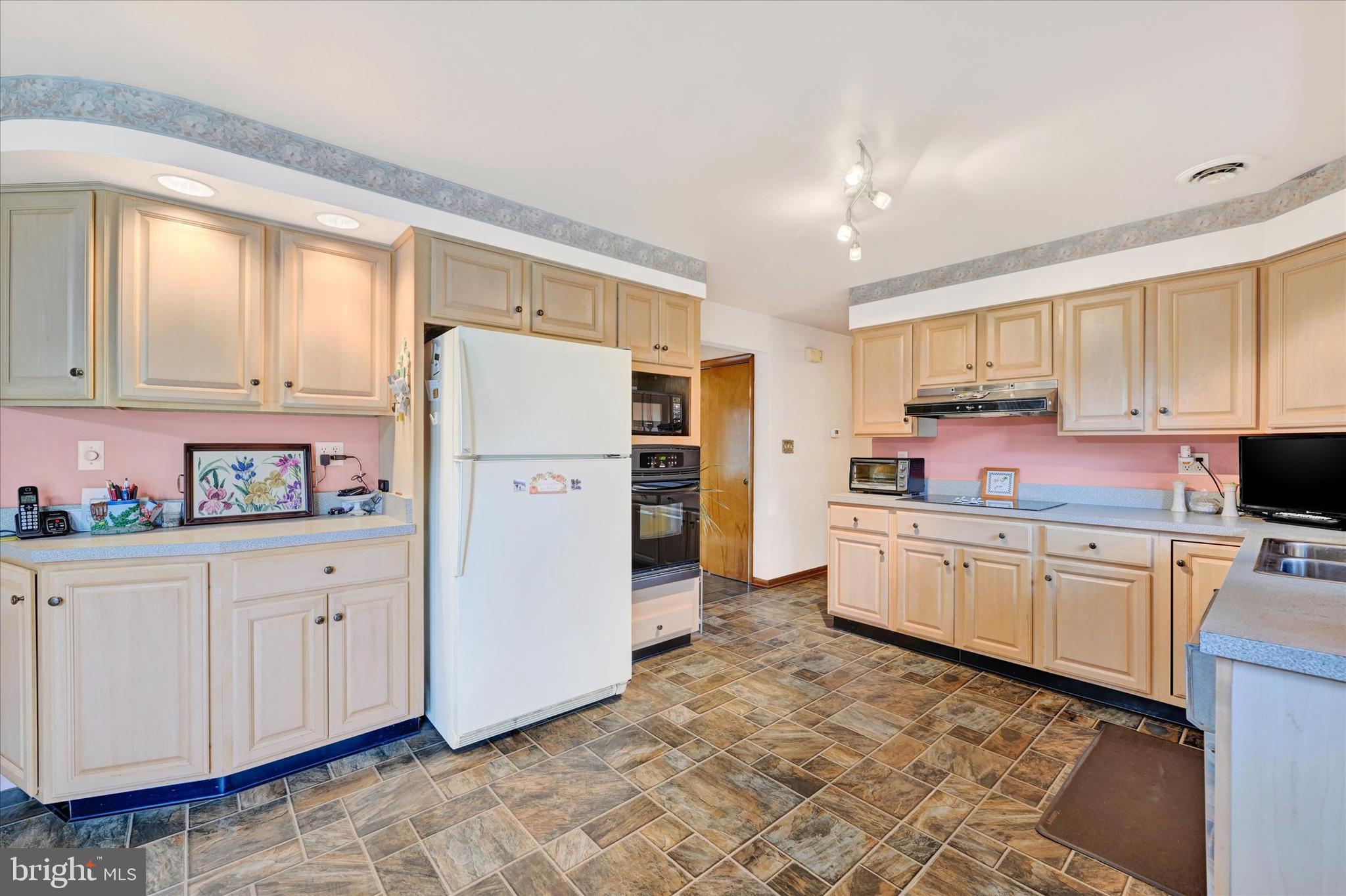 700 Remington Road Fallston, MD 21047 - Photo 5 of 42 a kitchen with granite countertop a refrigerator stove top oven and sink