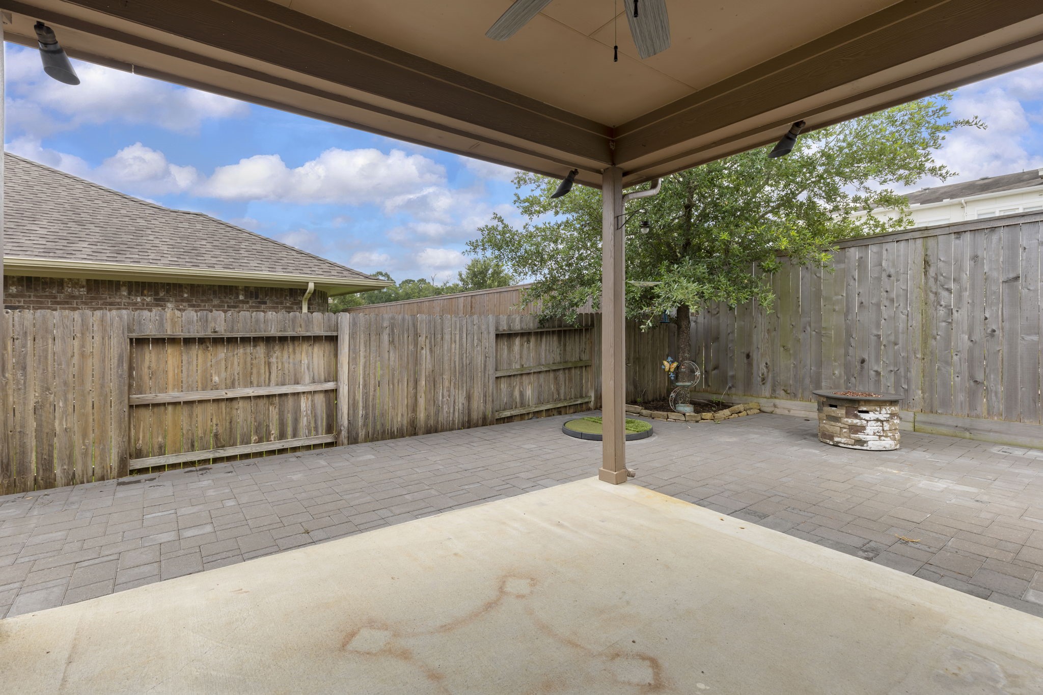 23911 Augusta Falls Lane Spring, TX 77389 - Photo 33 of 40 a view of a backyard with a large tree