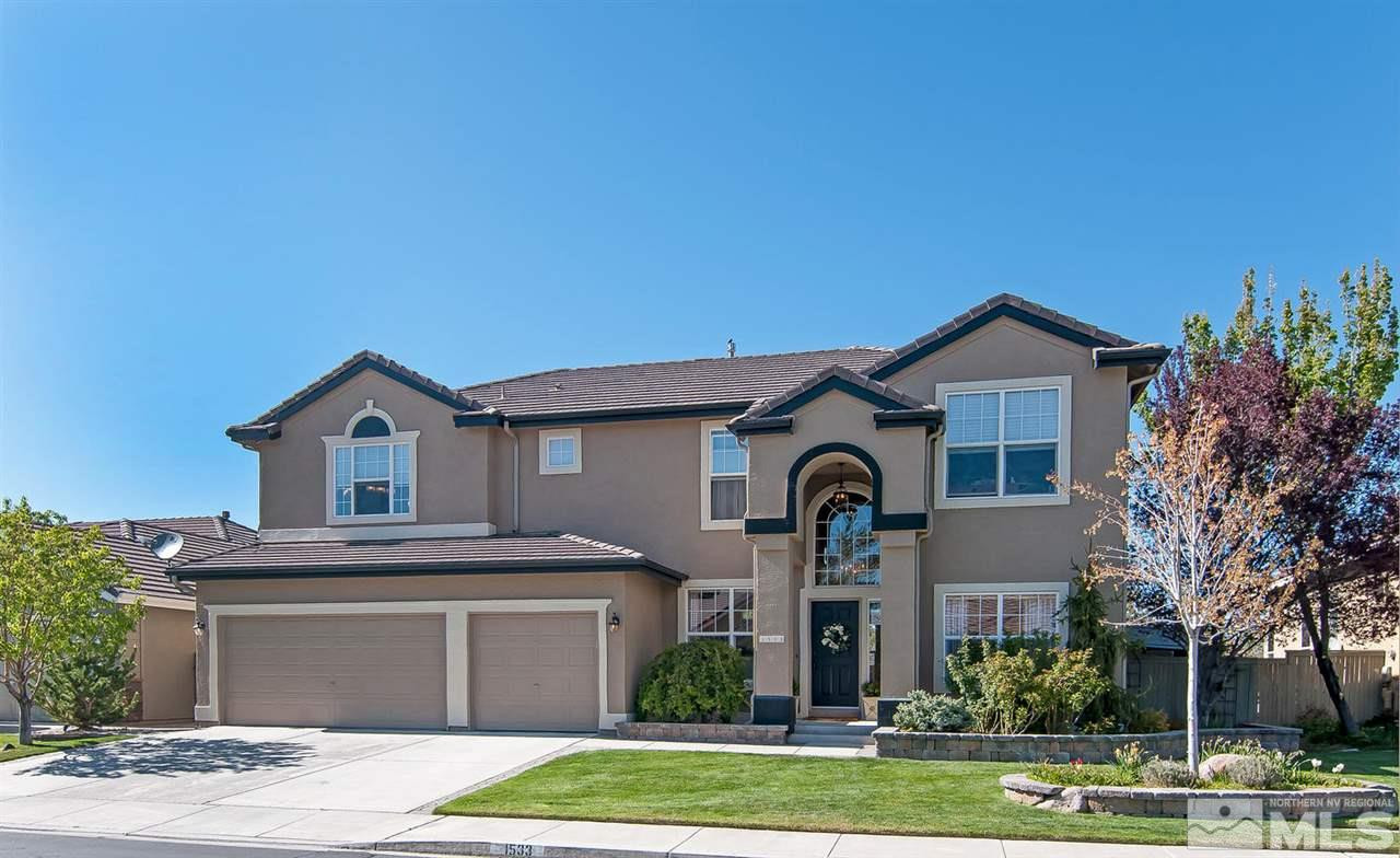 1533 Diamond Country Drive Reno, NV 89521 - Photo 1 of 1 a front view of a house with a yard and garage