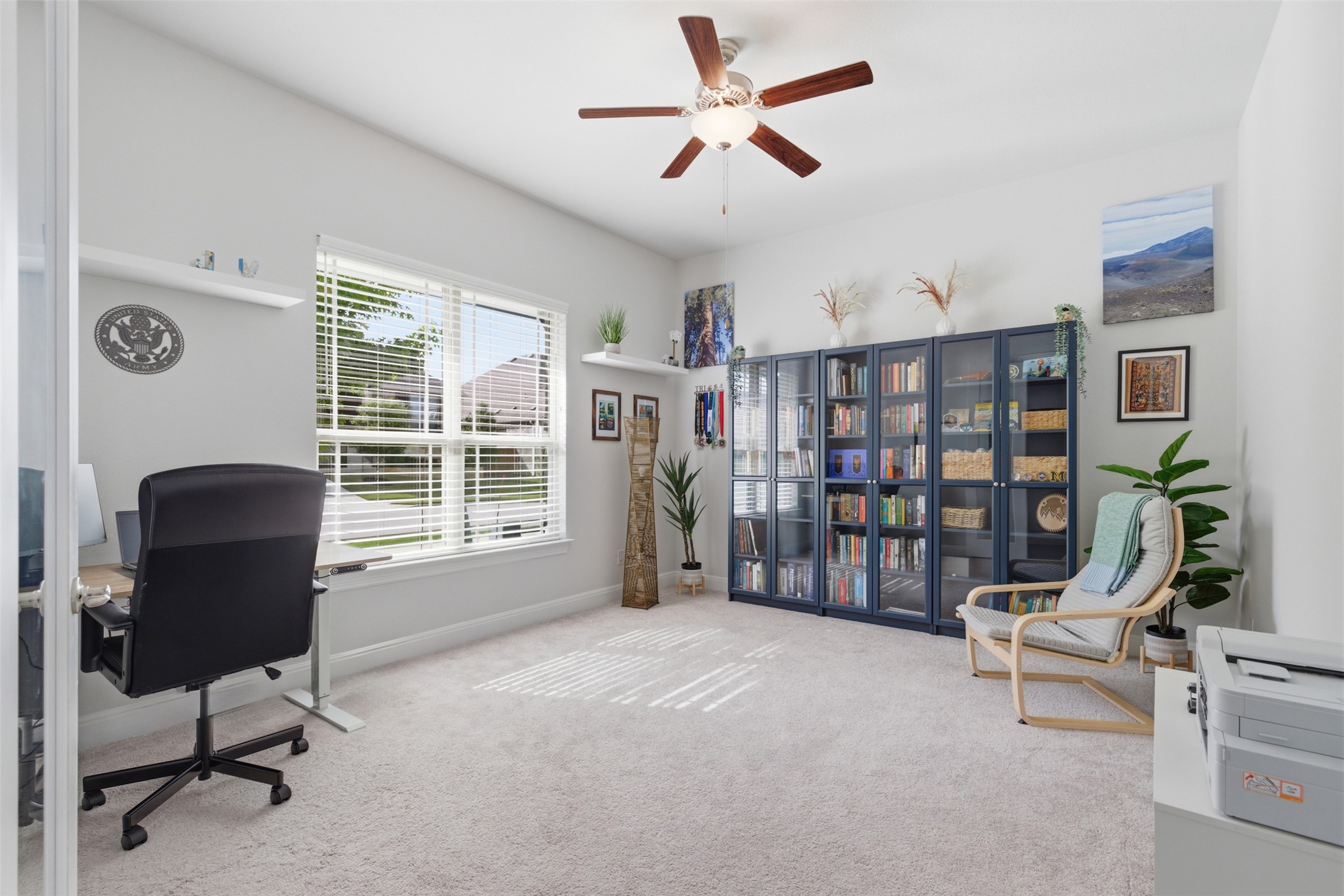118 Bear Paw Run Georgetown, TX 78628 - Photo 20 of 35 Bright room featuring light-colored carpeting, a window with blinds, and recessed shelving
