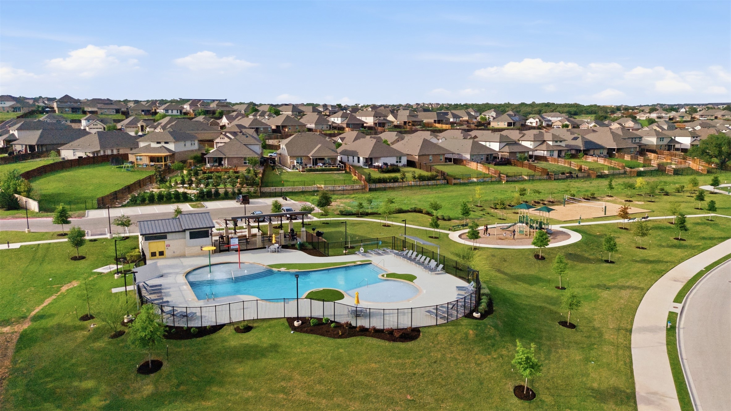 118 Bear Paw Run Georgetown, TX 78628 - Photo 32 of 35 The property is located within a community featuring a swimming pool, a dedicated splash pad area, and extensive green spaces