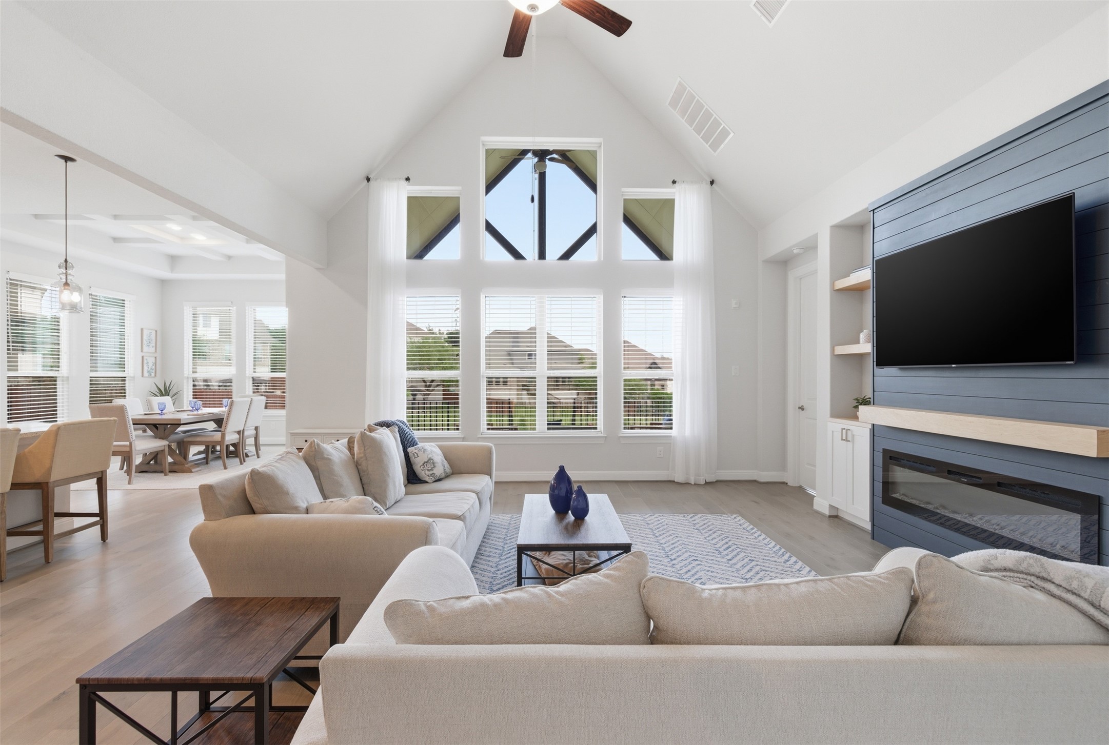 118 Bear Paw Run Georgetown, TX 78628 - Photo 6 of 35 The living area features vaulted ceilings, large windows providing ample natural light, and light-toned flooring